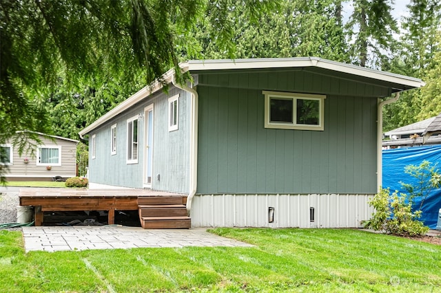 view of home's exterior with a yard