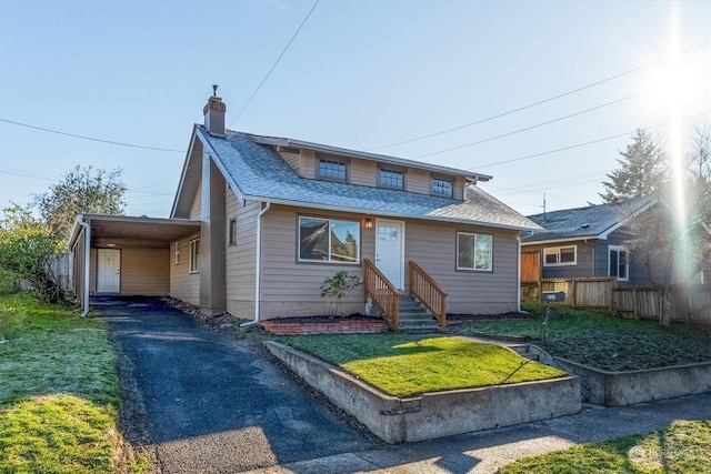 bungalow-style house with a front lawn and a carport