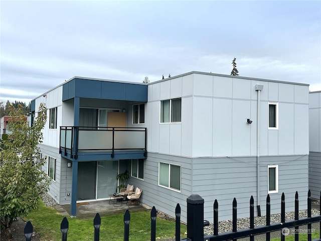 rear view of house with a balcony