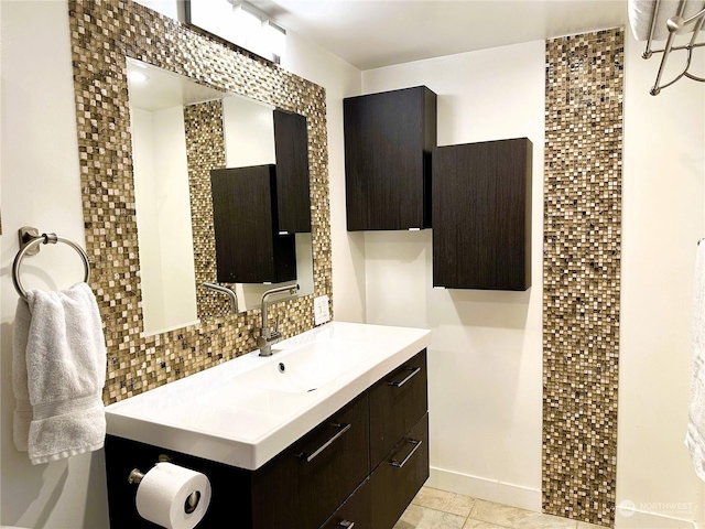 bathroom featuring vanity, backsplash, and tile patterned floors