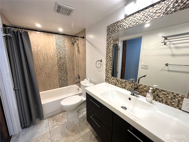 full bathroom featuring backsplash, vanity, shower / bath combo, and toilet