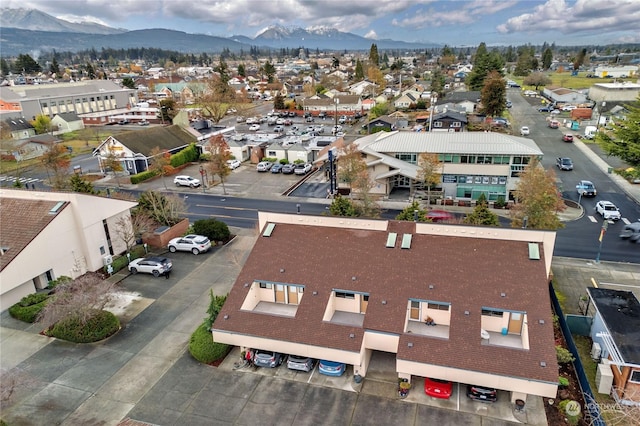 birds eye view of property with a mountain view