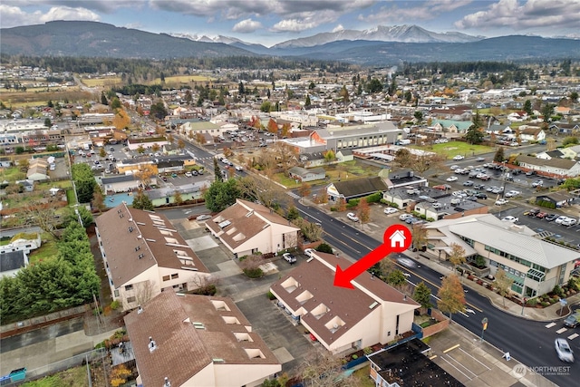 birds eye view of property featuring a mountain view