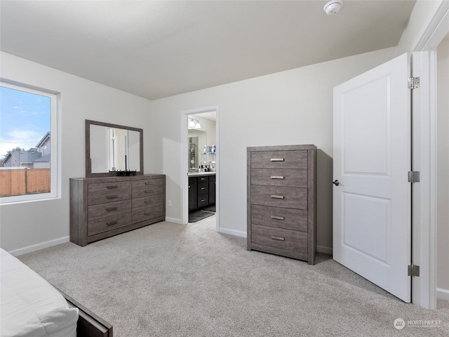 carpeted bedroom with ensuite bathroom