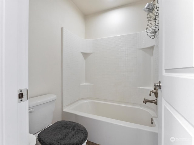 bathroom featuring shower / bathtub combination and toilet