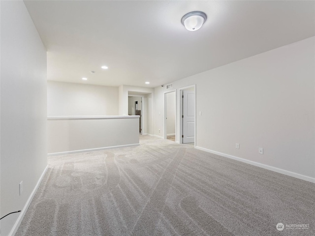 empty room with light colored carpet