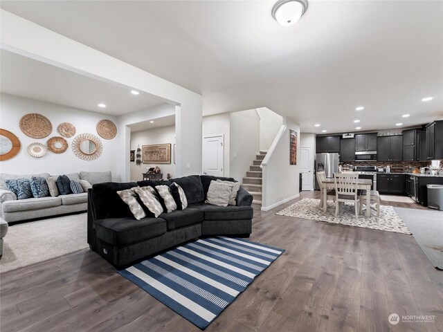 living room with dark hardwood / wood-style flooring