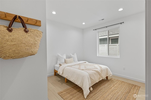 bedroom with light wood-type flooring