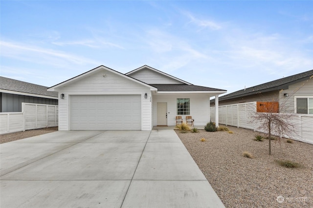 ranch-style house with covered porch and a garage