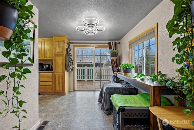 interior space featuring a textured ceiling