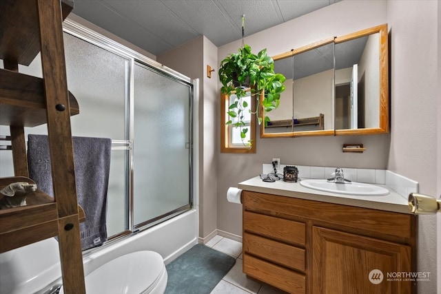 full bathroom with enclosed tub / shower combo, tile patterned floors, a textured ceiling, toilet, and vanity