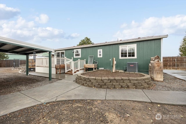 back of property with central AC unit