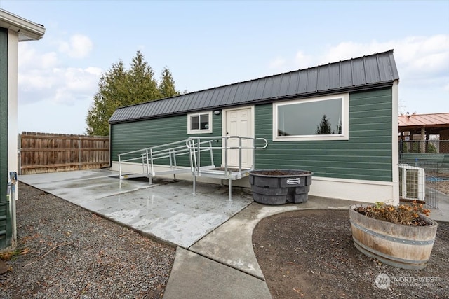 rear view of property with a patio and central AC unit