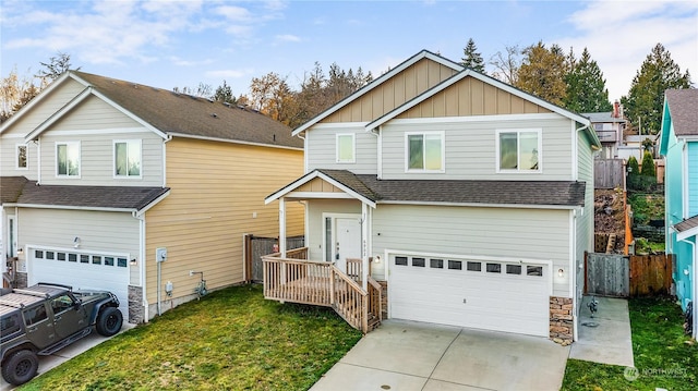 view of front of house with a front yard and a garage