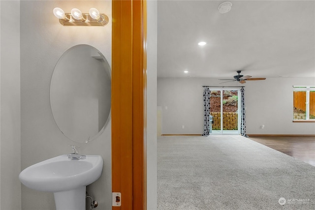 bathroom with ceiling fan and sink