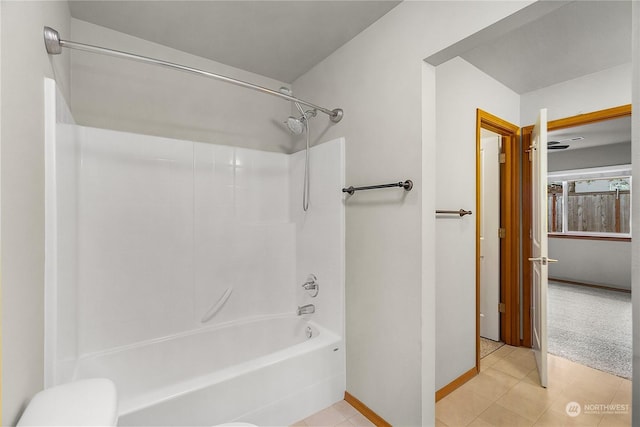 bathroom with tile patterned flooring and  shower combination