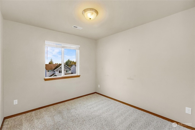 unfurnished room with carpet floors