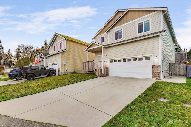 view of front of home featuring a front lawn and a garage