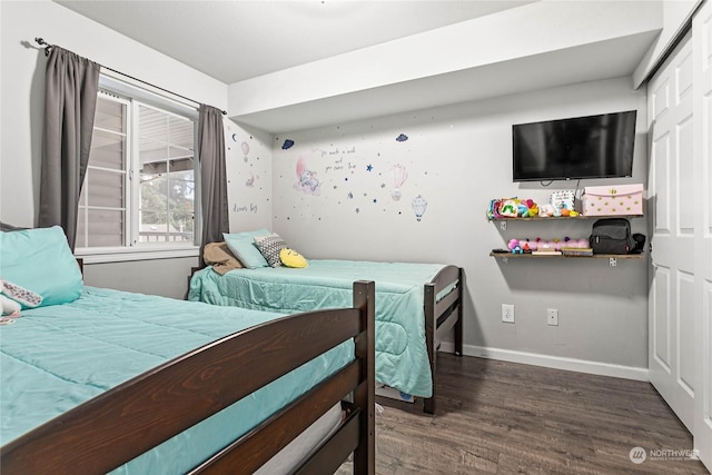 bedroom featuring dark wood-type flooring