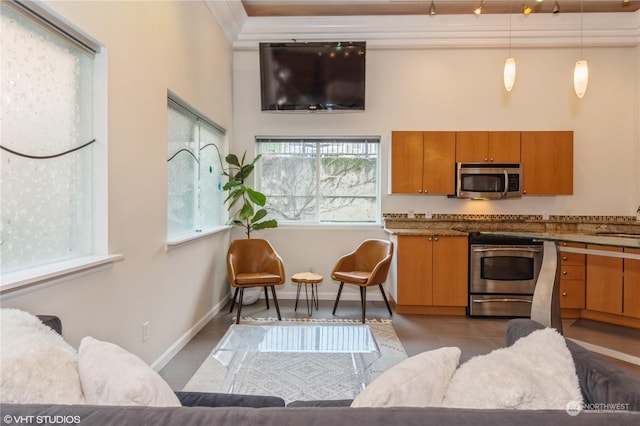 kitchen with pendant lighting, light tile patterned floors, stainless steel appliances, and sink