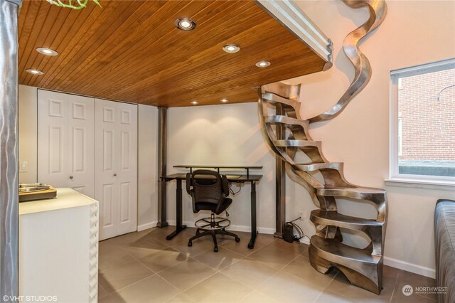 office with light tile patterned floors and wooden ceiling