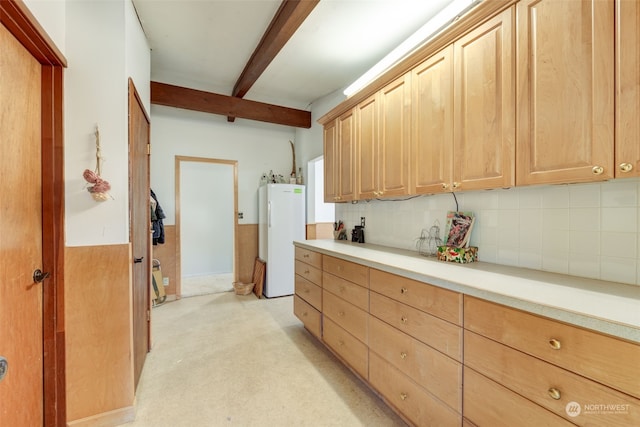 kitchen featuring decorative backsplash, beam ceiling, light colored carpet, and water heater