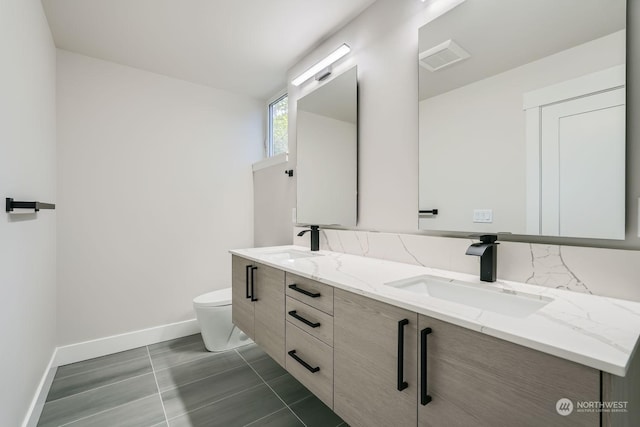 bathroom with vanity and toilet