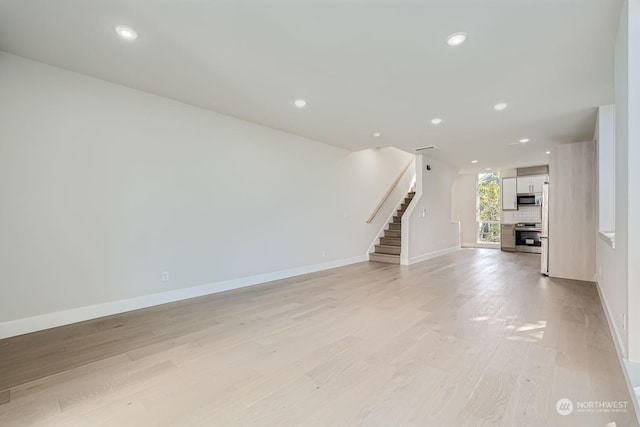 unfurnished living room with light hardwood / wood-style flooring