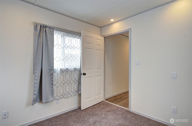 unfurnished bedroom with carpet floors