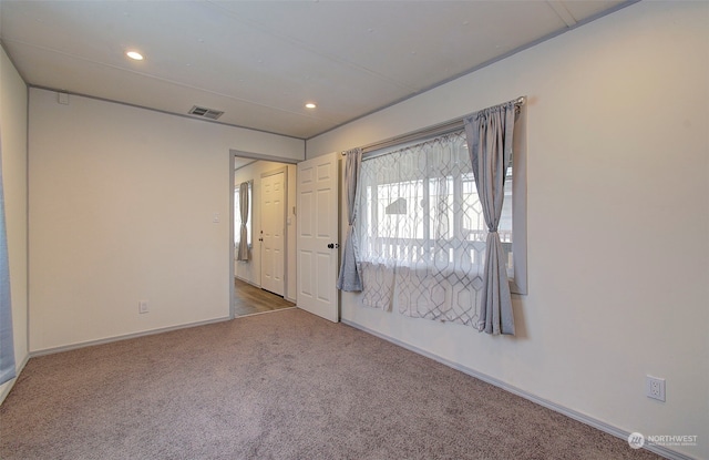 empty room with carpet flooring