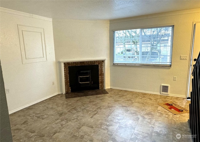 unfurnished living room featuring a wood stove, ornamental molding, and a wealth of natural light