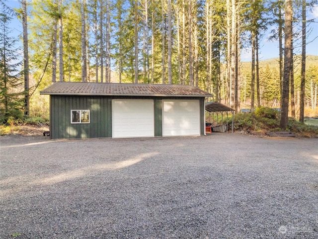 garage featuring a carport