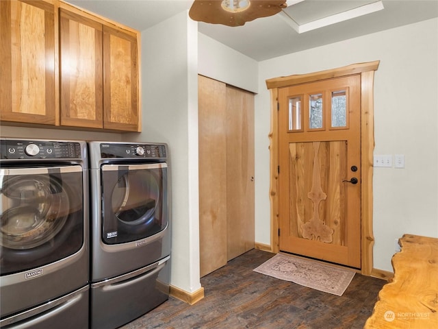 washroom featuring independent washer and dryer, cabinets, and dark hardwood / wood-style flooring