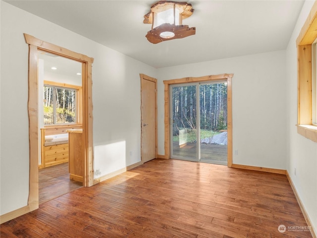 spare room with hardwood / wood-style flooring