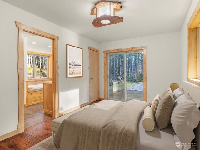 bedroom with wood-type flooring and access to exterior