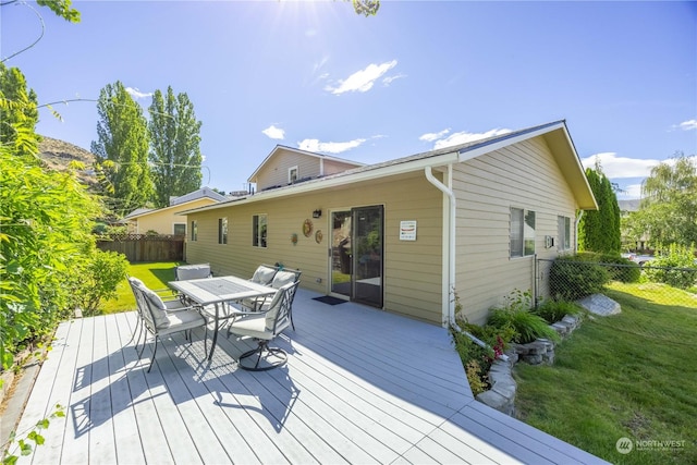 wooden terrace with a yard