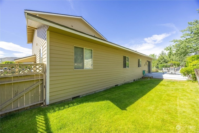 view of property exterior featuring a lawn