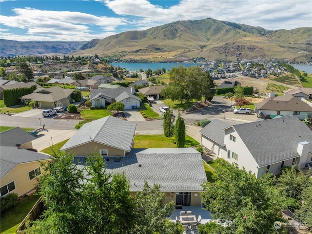 bird's eye view featuring a water and mountain view