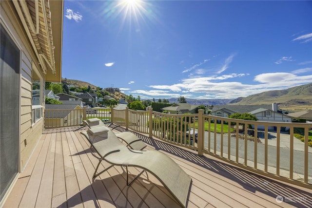 wooden deck featuring a mountain view