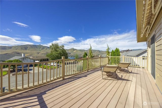 wooden deck with a mountain view