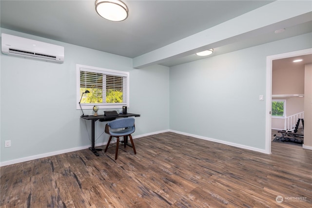 spare room with dark hardwood / wood-style flooring and a wall mounted air conditioner