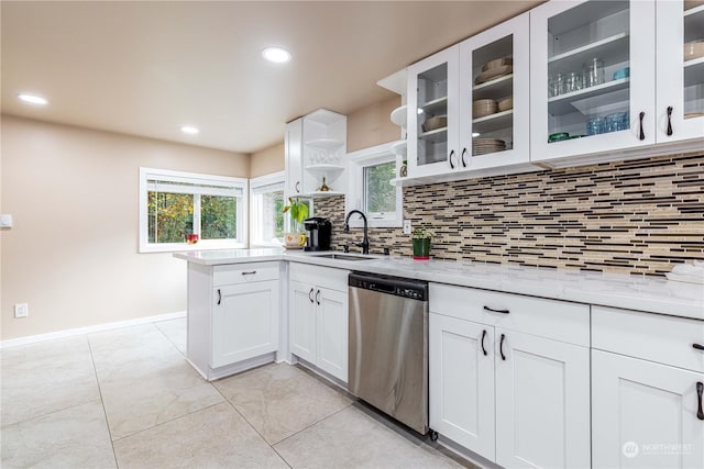 kitchen with a sink, decorative backsplash, open shelves, and dishwasher