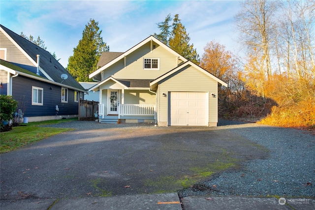 view of front of house featuring a porch and a garage