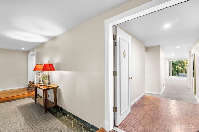 hallway featuring light parquet flooring