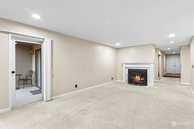 unfurnished living room featuring light colored carpet