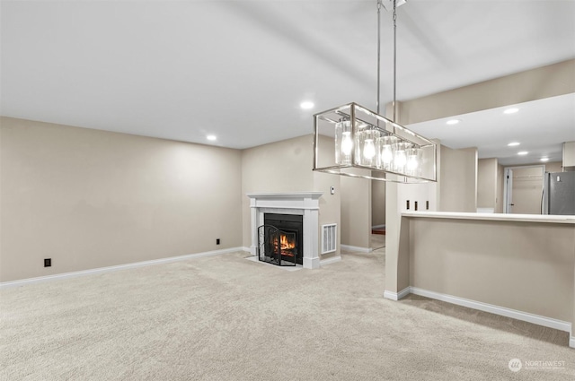 unfurnished living room with light carpet