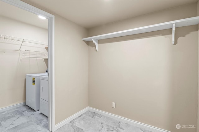 laundry area featuring washer and clothes dryer