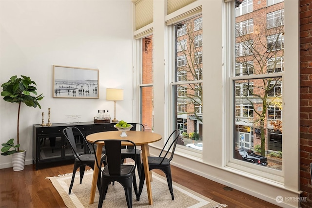 dining area featuring dark wood-type flooring