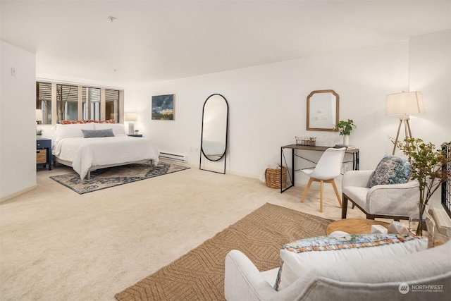 carpeted bedroom featuring a baseboard heating unit