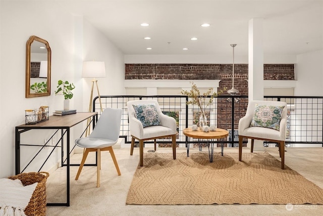 sitting room featuring carpet